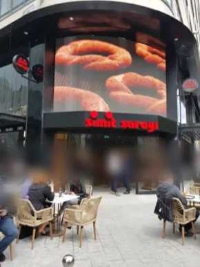 Simit Sarayı corner store frontage with an LED screen, Leicester Square, London